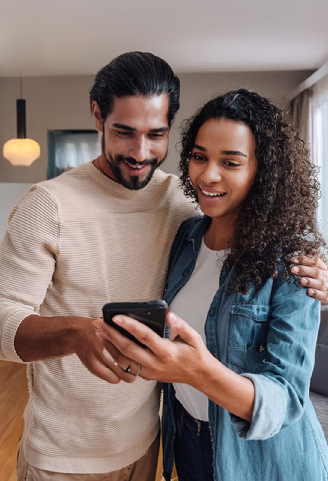 A couple interacting with a mobile phone